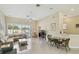 Open living room with vaulted ceilings, tiled floors, comfortable seating, and natural light from the window at 2216 Evans Rd, Clearwater, FL 33763