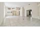 Open-concept living room with high ceilings, tiled floors, and a view of the home's layout at 2216 Evans Rd, Clearwater, FL 33763