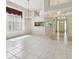 Open floorplan with tile flooring, chandelier, and seamless access to the entryway and kitchen area at 2216 Evans Rd, Clearwater, FL 33763