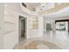 Open living room features high ceilings, decorative shelving, arched entryways leading to other rooms at 2216 Evans Rd, Clearwater, FL 33763