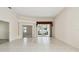 Spacious living room featuring tile floors and access to the screened-in lanai at 2216 Evans Rd, Clearwater, FL 33763