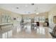 Meeting room featuring tables, chairs, tile floors, and bright lighting provided by windows and ceiling lights at 2216 Evans Rd, Clearwater, FL 33763