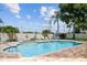 Community pool area with a hot tub, surrounded by a brick patio and offering a relaxing and social gathering space at 2216 Evans Rd, Clearwater, FL 33763