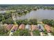 Aerial view showcasing the property's location on a waterfront lot with mature trees at 2617 Heatherwood Dr, Tampa, FL 33618