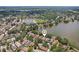 Wide aerial shot revealing a neighborhood nestled among lakes at 2617 Heatherwood Dr, Tampa, FL 33618