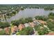 Aerial view showcasing the property's location on a waterfront lot with mature trees at 2617 Heatherwood Dr, Tampa, FL 33618