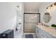 Bathroom featuring a walk-in shower, single sink vanity, and easy access to the toilet at 2617 Heatherwood Dr, Tampa, FL 33618