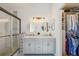 Stylish bathroom features a spacious walk-in shower, double sinks, and ample storage at 2617 Heatherwood Dr, Tampa, FL 33618