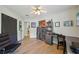 Spacious bedroom featuring wood flooring, a desk, and a stylish accent chair at 2617 Heatherwood Dr, Tampa, FL 33618