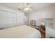 Cozy bedroom with closet, ceiling fan, desk and shelves is perfect for work or relaxation at 2617 Heatherwood Dr, Tampa, FL 33618