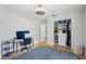 Bedroom features hardwood floors, closet and a dedicated workspace at 2617 Heatherwood Dr, Tampa, FL 33618