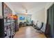 Bedroom with wood flooring, a ceiling fan, and a desk setup with instruments for entertainment at 2617 Heatherwood Dr, Tampa, FL 33618