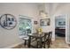 Dining area with stylish decor and view to the screened patio overlooking the backyard at 2617 Heatherwood Dr, Tampa, FL 33618
