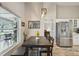Charming dining area with wood table, bench seating, and view to a cozy screened patio at 2617 Heatherwood Dr, Tampa, FL 33618