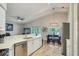 Open-concept kitchen with sleek countertops and view to dining and living areas at 2617 Heatherwood Dr, Tampa, FL 33618