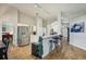 Open kitchen with breakfast bar seating offering a view to dining and kitchen areas at 2617 Heatherwood Dr, Tampa, FL 33618