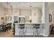 Contemporary kitchen with white cabinetry and breakfast bar at 2617 Heatherwood Dr, Tampa, FL 33618