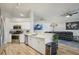 Bright, modern kitchen with stainless steel appliances and open view to living room at 2617 Heatherwood Dr, Tampa, FL 33618