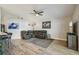 Spacious living area featuring wood-look floors, comfortable seating, and modern decor at 2617 Heatherwood Dr, Tampa, FL 33618