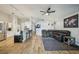 Bright, open-concept space featuring modern furnishings and a seamless flow from living to dining at 2617 Heatherwood Dr, Tampa, FL 33618