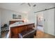 Relaxing main bedroom with a king bed, lamp, and bathroom with barn door at 2617 Heatherwood Dr, Tampa, FL 33618