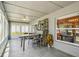 Sunroom with tile floors, lots of windows and backyard views at 2617 Heatherwood Dr, Tampa, FL 33618