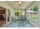 Bright sunroom with lots of windows, tile floors and comfortable seating at 2617 Heatherwood Dr, Tampa, FL 33618