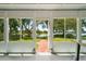 Sunroom features a brick walkway leading to the lake, offering picturesque outdoor views at 2617 Heatherwood Dr, Tampa, FL 33618