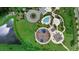 Aerial view showcases pool, playground and cabana amenities within a landscaped community at 33255 Kateland Dr, Wesley Chapel, FL 33545