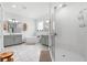 Bathroom with double sink vanity, soaking tub, walk-in shower, and tile flooring at 33255 Kateland Dr, Wesley Chapel, FL 33545