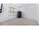 Cozy bedroom with window and closet covered with black tarp at 33255 Kateland Dr, Wesley Chapel, FL 33545