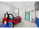 Bright room with a red car bed, climbing bars, and ample closet space at 33255 Kateland Dr, Wesley Chapel, FL 33545