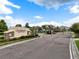 Community entrance features a stone sign and gated entry at 33255 Kateland Dr, Wesley Chapel, FL 33545