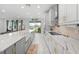 Bright kitchen with white cabinets, stainless steel appliances, and a large island at 33255 Kateland Dr, Wesley Chapel, FL 33545