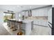 Bright and spacious kitchen featuring a large center island with seating and stainless steel appliances at 33255 Kateland Dr, Wesley Chapel, FL 33545