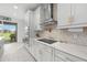 Well-appointed kitchen with white cabinets, marble countertops and stainless steel appliances at 33255 Kateland Dr, Wesley Chapel, FL 33545