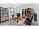 Modern office boasts sleek desk, built-in shelving, and bright natural light at 33255 Kateland Dr, Wesley Chapel, FL 33545