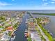 Aerial view of waterfront community featuring canals, boat docks, and beautiful landscaping at 4012 Marine Pkwy, New Port Richey, FL 34652