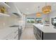 Open kitchen with stainless steel appliances, granite countertops and a view of the canal at 4012 Marine Pkwy, New Port Richey, FL 34652