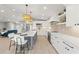Bright kitchen featuring stainless steel appliances, pendant lighting, and an open floor plan at 4012 Marine Pkwy, New Port Richey, FL 34652