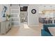 Bright living room featuring a sliding barn door that opens into a home office and kitchen at 4012 Marine Pkwy, New Port Richey, FL 34652