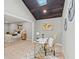 Home office near the main bedroom features a stylish desk and bright skylight at 4012 Marine Pkwy, New Port Richey, FL 34652