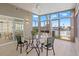 Sunroom featuring walls of windows overlooking a waterfront view at 4012 Marine Pkwy, New Port Richey, FL 34652