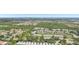 This aerial view of the community highlights the lush greenery, serene ponds, and convenient location at 404 Laurel Lake Dr # 101, Venice, FL 34292