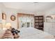 Bright bedroom featuring a ceiling fan and a sunny window at 404 Laurel Lake Dr # 101, Venice, FL 34292