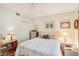 Comfortable bedroom with a ceiling fan and lots of space for furnishings at 404 Laurel Lake Dr # 101, Venice, FL 34292