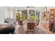 Bright dining area with hardwood floors and garden views, ideal for Gathering gatherings and entertaining at 404 Laurel Lake Dr # 101, Venice, FL 34292