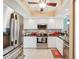 Modern kitchen with stainless steel appliances, granite countertops, and ample cabinet space for cooking convenience at 404 Laurel Lake Dr # 101, Venice, FL 34292