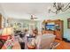Comfortable living area with a view, hardwood floors, and a ceiling fan creating an inviting living space at 404 Laurel Lake Dr # 101, Venice, FL 34292