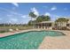 Enjoy the community pool with lounge chairs and a serene screened area, perfect for relaxation at 404 Laurel Lake Dr # 101, Venice, FL 34292